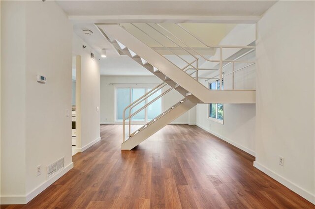 587 Virginia Ave NE Unit 315, Atlanta, GA 30306 - interior space featuring visible vents, baseboards, wood finished floors, and stairs