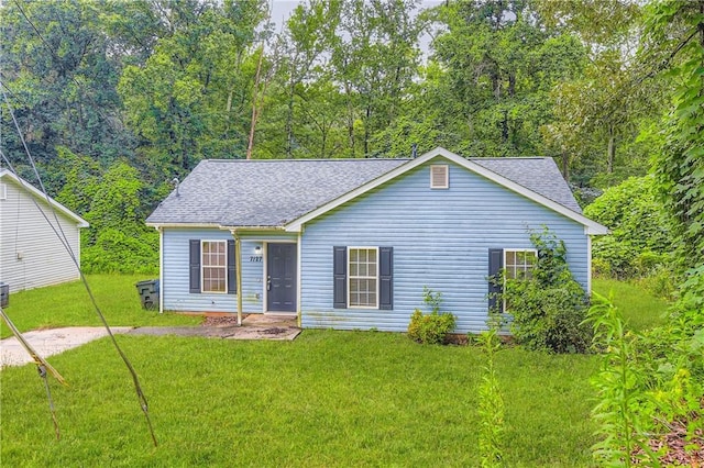 7127 Greenway Cv SW, Covington, GA 30014 - view of front of property with a front yard and a shingled roof