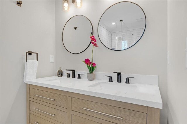 bathroom with double vanity and a sink