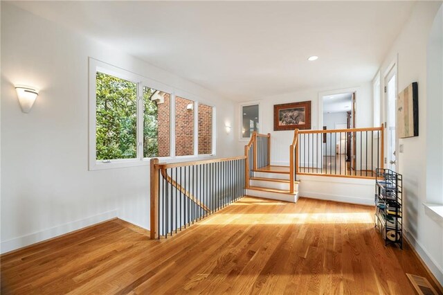 4835 Merlendale Ct, Atlanta, GA 30327 - interior space with wood finished floors, visible vents, and an upstairs landing