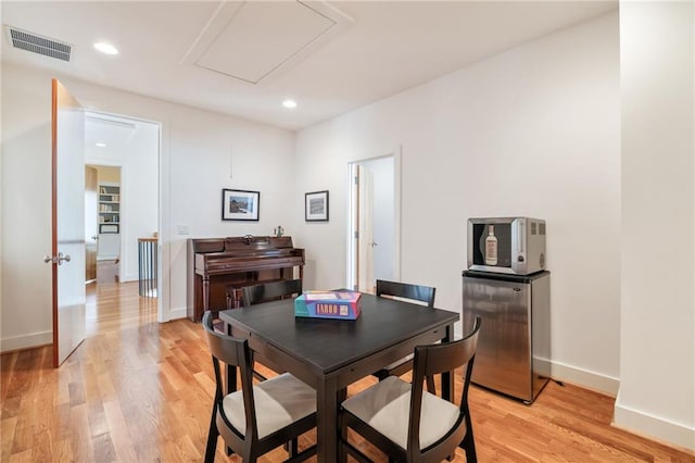 4835 Merlendale Ct, Atlanta, GA 30327 - dining room with attic access, baseboards, visible vents, and light wood-style floors