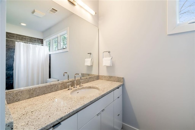 4835 Merlendale Ct, Atlanta, GA 30327 - bathroom with vanity, curtained shower, and visible vents