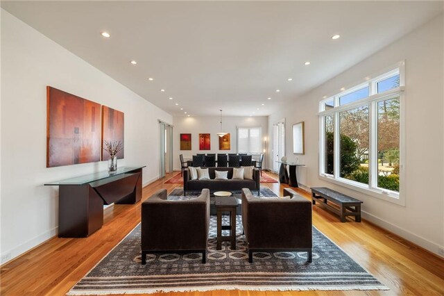 4835 Merlendale Ct, Atlanta, GA 30327 - living room featuring light wood-style floors, baseboards, a wealth of natural light, and recessed lighting