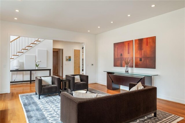 4835 Merlendale Ct, Atlanta, GA 30327 - living area featuring stairway, baseboards, wood finished floors, and recessed lighting
