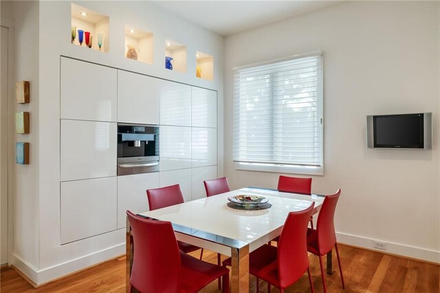 4835 Merlendale Ct, Atlanta, GA 30327 - dining room with baseboards and light wood-style floors