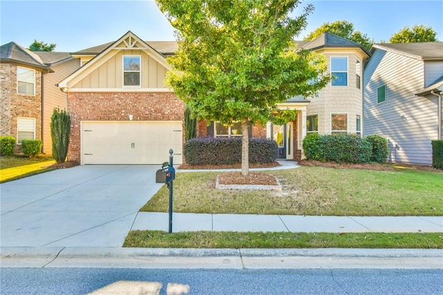 view of front of property featuring a front yard and a garage