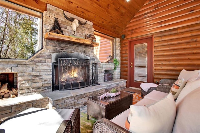 living area featuring rustic walls, wooden ceiling, an outdoor stone fireplace, and lofted ceiling