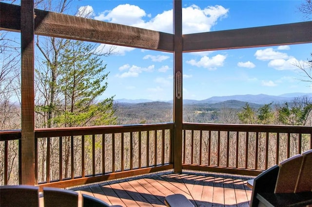 wooden terrace featuring a mountain view