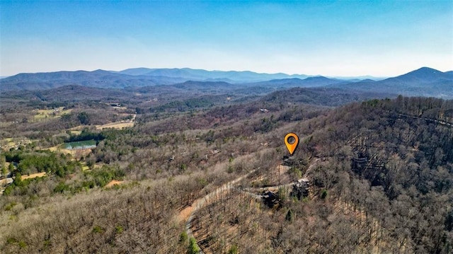 aerial view featuring a mountain view and a forest view