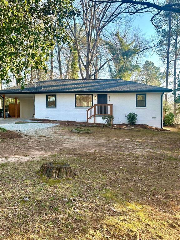 view of front of property with an attached carport