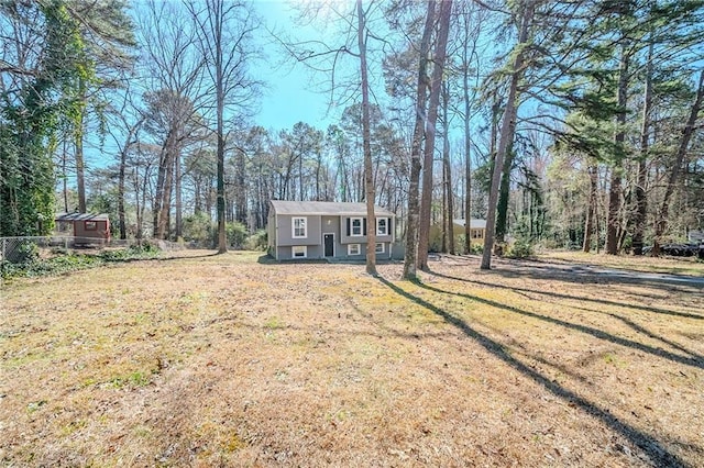 split foyer home with a front lawn