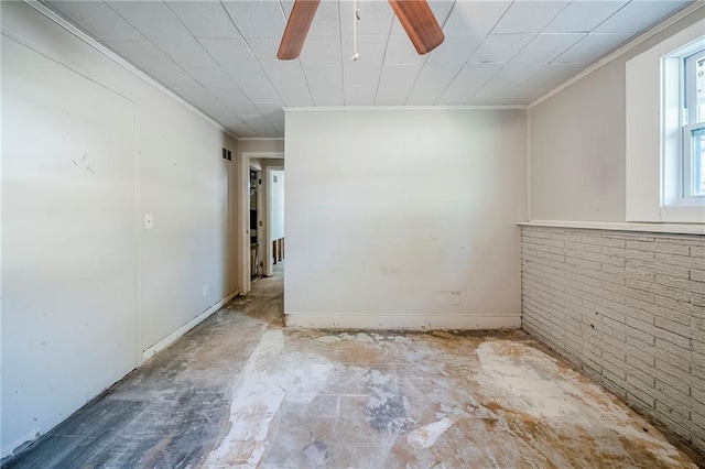 unfurnished room with unfinished concrete flooring, visible vents, crown molding, and ceiling fan