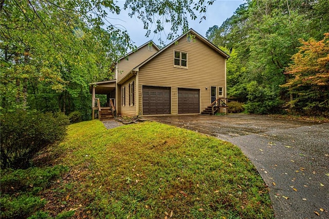 view of property exterior with a lawn, a porch, and a garage