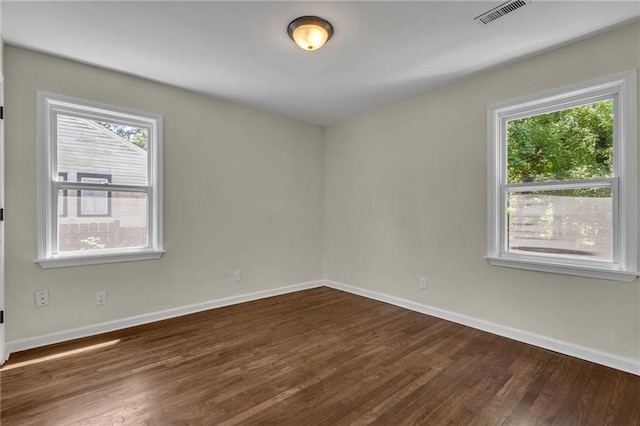 2115 Pinehurst Dr, East Point, GA 30344 - spare room with dark wood-type flooring and baseboards