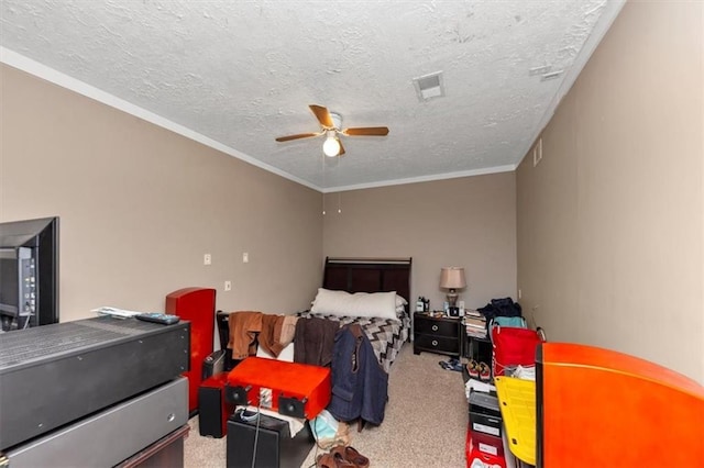 bedroom with carpet flooring, a textured ceiling, ornamental molding, and ceiling fan