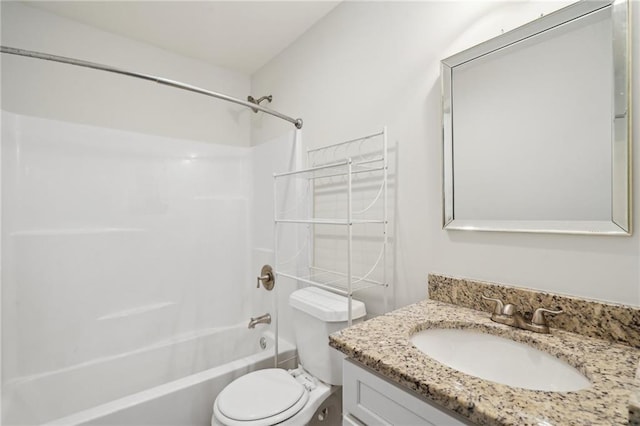 full bathroom with toilet, vanity, and washtub / shower combination