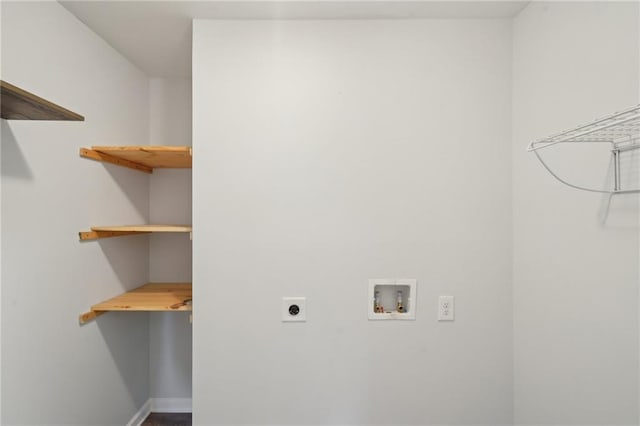 laundry room featuring washer hookup, electric dryer hookup, and baseboards
