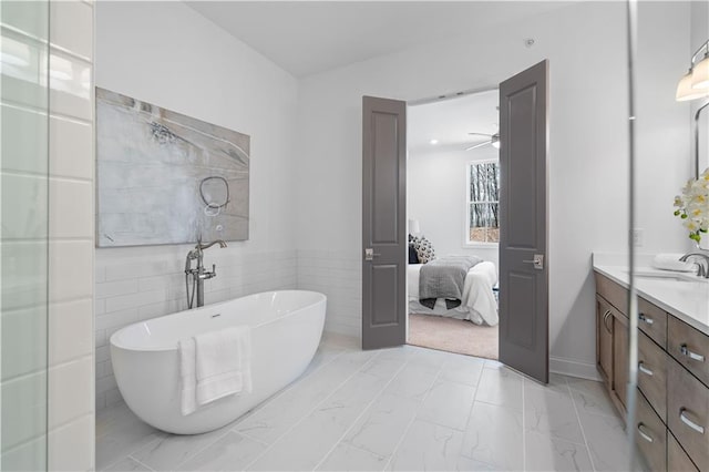 4933 Sudbrook Way Unit 230, Peachtree Corners, GA 30092 - full bath with double vanity, a freestanding tub, marble finish floors, and ensuite bath