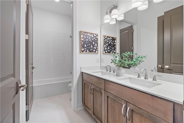 4933 Sudbrook Way Unit 230, Peachtree Corners, GA 30092 - bathroom featuring marble look tiles, double vanity, toilet, and shower / washtub combination
