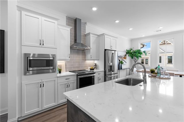 4933 Sudbrook Way Unit 230, Peachtree Corners, GA 30092 - kitchen with wall chimney exhaust hood, stainless steel appliances, a sink, tasteful backsplash, and crown molding