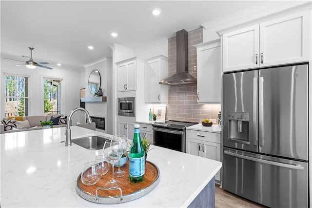 4933 Sudbrook Way Unit 230, Peachtree Corners, GA 30092 - kitchen with stainless steel appliances, wall chimney range hood, a sink, ornamental molding, and ceiling fan