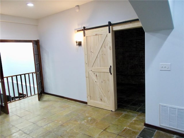 interior space featuring a barn door