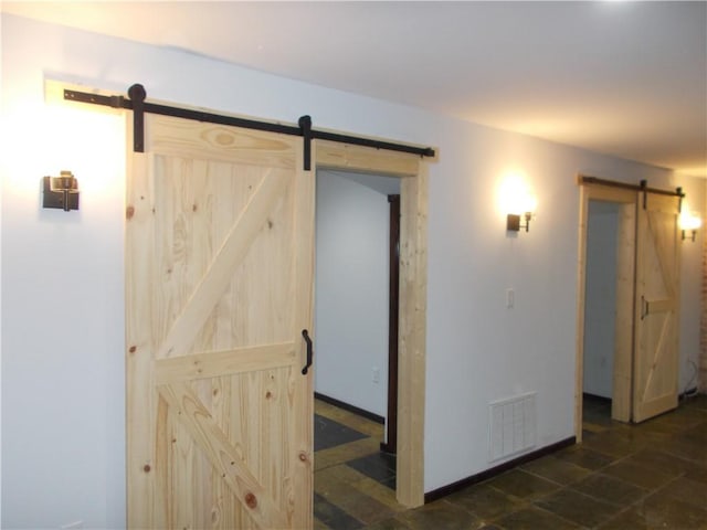 interior space featuring a barn door