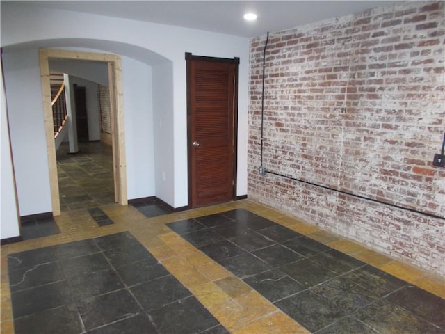 empty room with brick wall