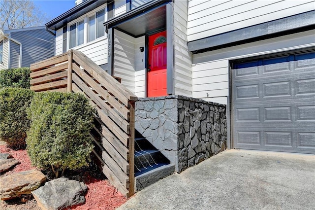 doorway to property featuring a garage