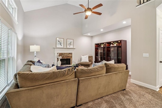 1006 Amberton Ln, Powder Springs, GA 30127 - carpeted living room with ceiling fan, high vaulted ceiling, a fireplace, baseboards, and recessed lighting