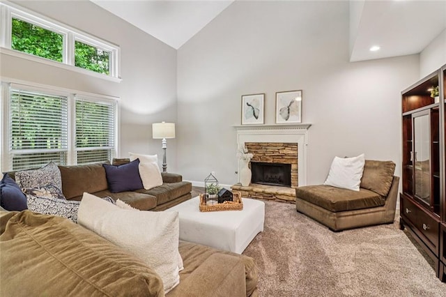 1006 Amberton Ln, Powder Springs, GA 30127 - carpeted living room with a stone fireplace, high vaulted ceiling, and recessed lighting