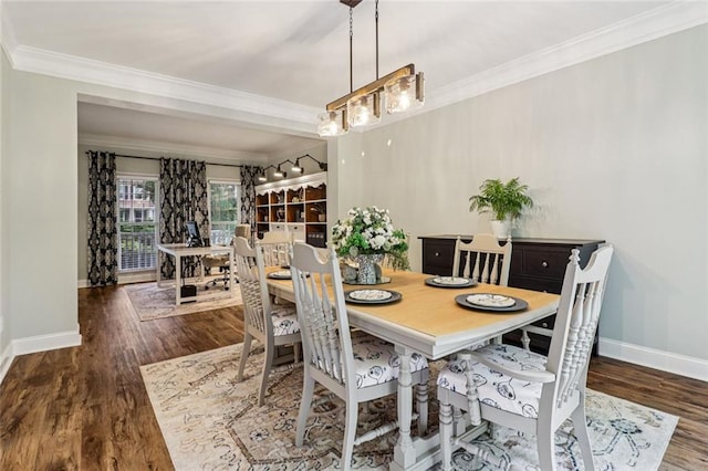 1006 Amberton Ln, Powder Springs, GA 30127 - dining space featuring ornamental molding, baseboards, and wood finished floors