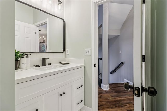 1006 Amberton Ln, Powder Springs, GA 30127 - bathroom featuring vanity, wood finished floors, and baseboards