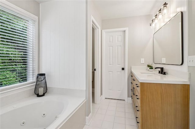 1006 Amberton Ln, Powder Springs, GA 30127 - bathroom with vanity, a whirlpool tub, tile patterned flooring, and healthy amount of natural light