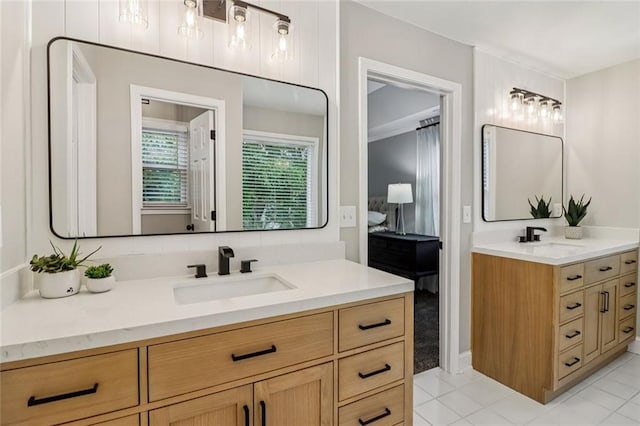 1006 Amberton Ln, Powder Springs, GA 30127 - bathroom with two vanities and tile patterned flooring