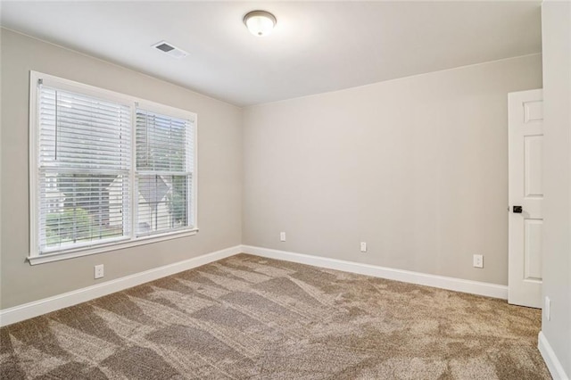 1006 Amberton Ln, Powder Springs, GA 30127 - empty room with healthy amount of natural light, carpet flooring, and baseboards