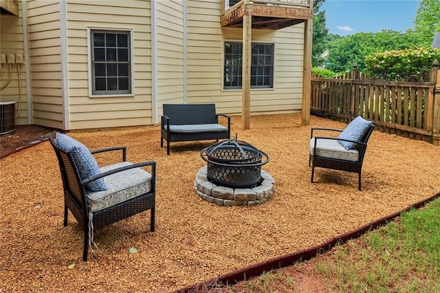 1006 Amberton Ln, Powder Springs, GA 30127 - view of patio / terrace with an outdoor fire pit and central AC