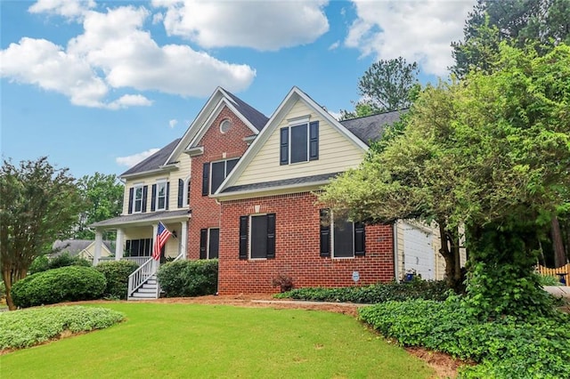 1006 Amberton Ln, Powder Springs, GA 30127 - traditional-style home with brick siding, a front yard, and a porch