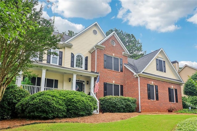 1006 Amberton Ln, Powder Springs, GA 30127 - view of front facade with brick siding and a front yard