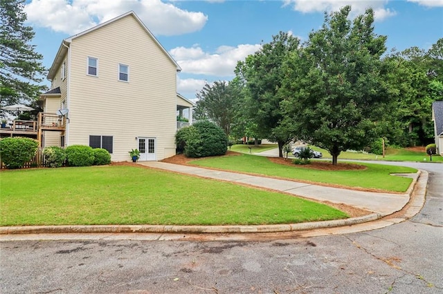 1006 Amberton Ln, Powder Springs, GA 30127 - view of side of property with a lawn and a wooden deck