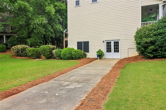1006 Amberton Ln, Powder Springs, GA 30127 - doorway to property featuring a yard and french doors
