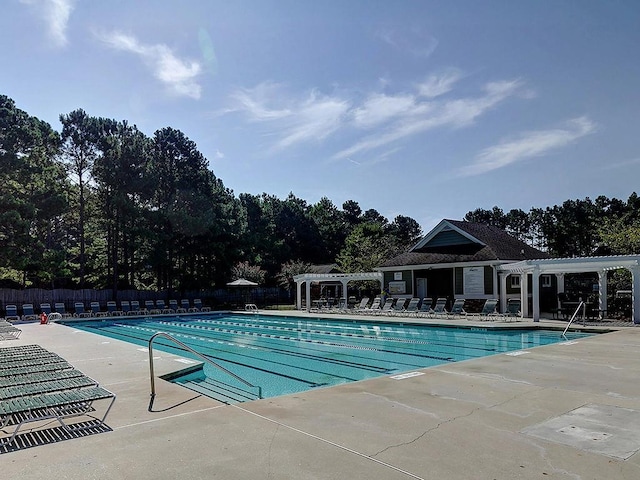 1006 Amberton Ln, Powder Springs, GA 30127 - community pool with a pergola, a patio, and view of scattered trees