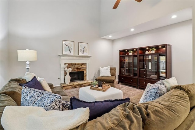 1006 Amberton Ln, Powder Springs, GA 30127 - carpeted living room with recessed lighting, a ceiling fan, a fireplace, and a high ceiling