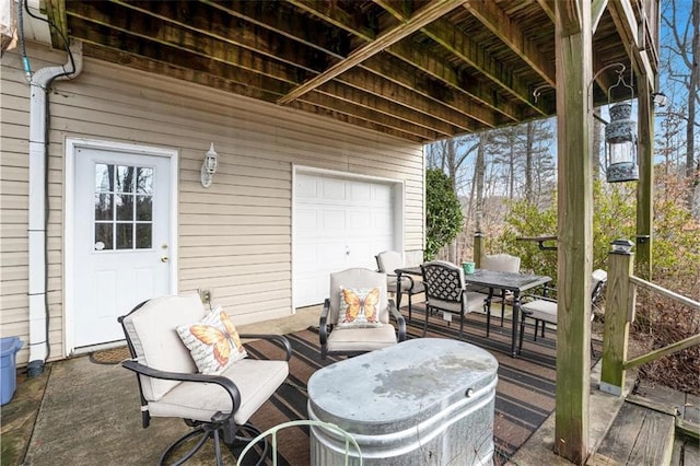 view of patio / terrace with a garage