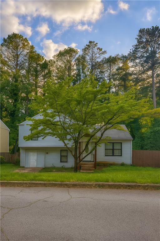 4728 Garden Hills Dr, Stone Mountain, GA 30083 - view of front facade with an attached garage