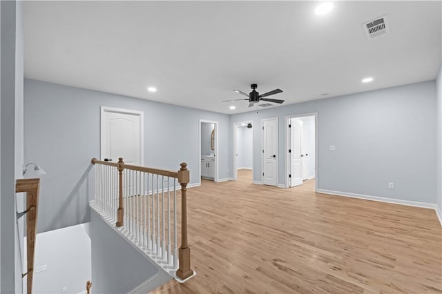 unfurnished room featuring visible vents, recessed lighting, light wood finished floors, baseboards, and ceiling fan