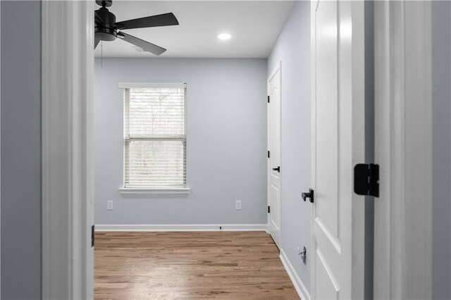 empty room with recessed lighting, wood finished floors, baseboards, and ceiling fan