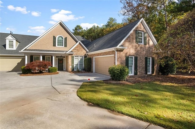 view of front of house featuring a garage and a front lawn