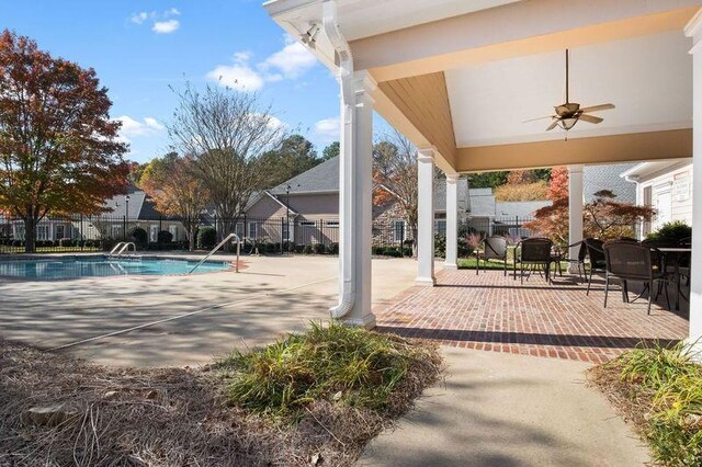 view of pool with ceiling fan and a patio area