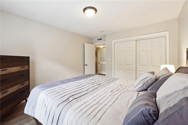 6851 Roswell Rd Unit E1, Atlanta, GA 30328 - bedroom with a closet, wood finished floors, and visible vents